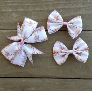 3-pack unicorn print bows/paquete de 3 moños estam